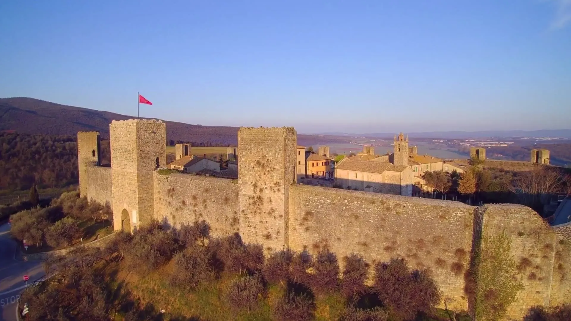 The Castle of Monteriggioni seen from above at sunset